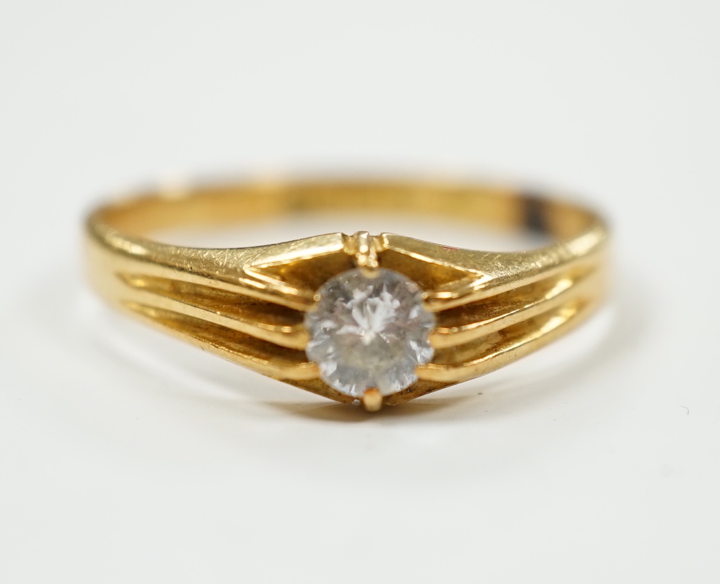 A George V 18ct gold and claw set solitaire diamond ring, size U/V, gross weight 3.6 grams.